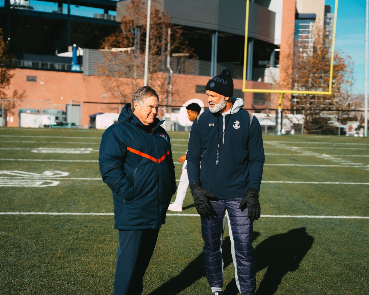 New England Patriots head coach Bill Belichick chats with Navy Football head coach Brian Newberry during practice on the Gillette Stadium practice fields.